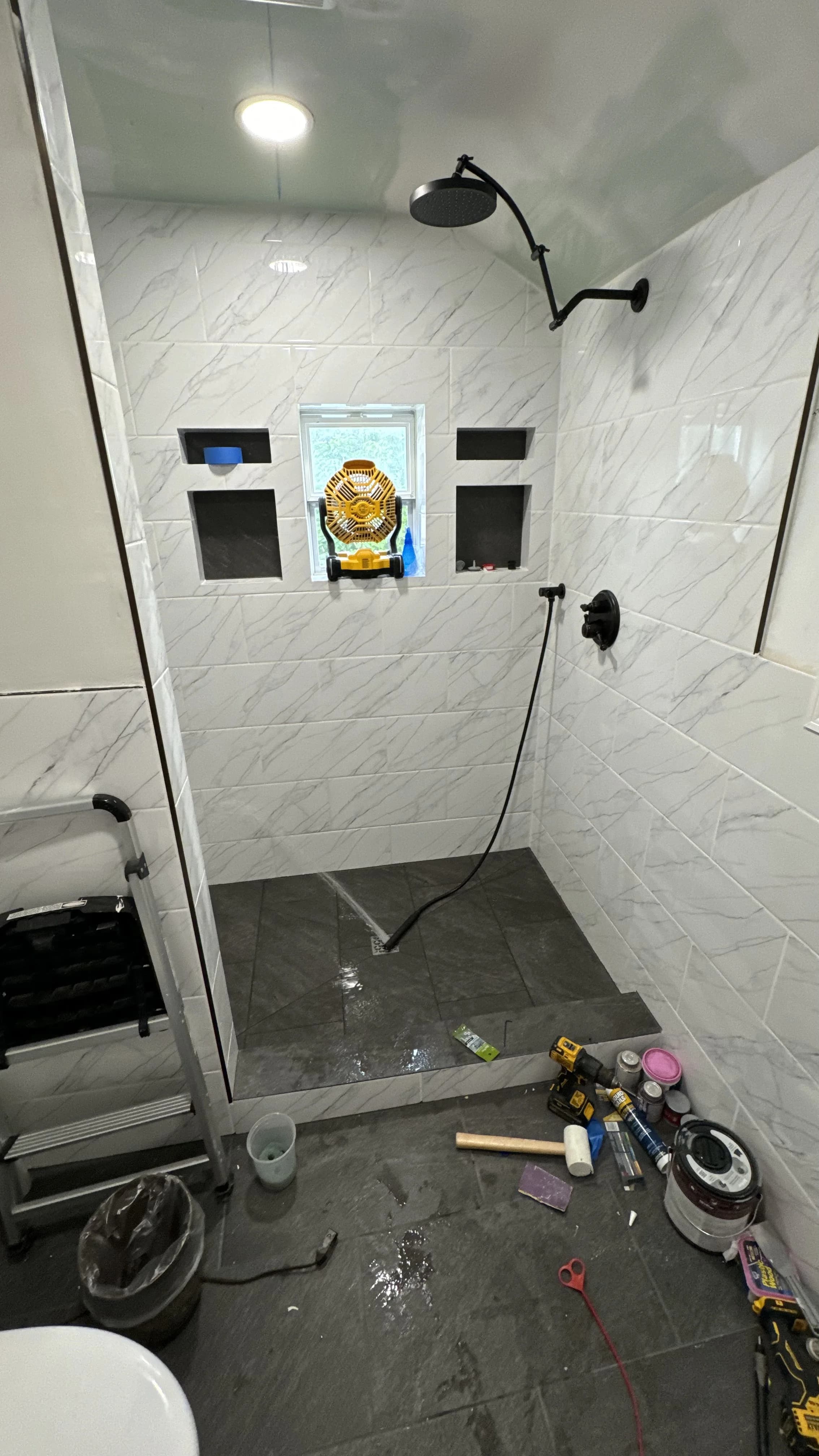 Walk-in shower renovation in Old Bridge NJ by LJT Contracting — marble tile, rain head, built-in niches